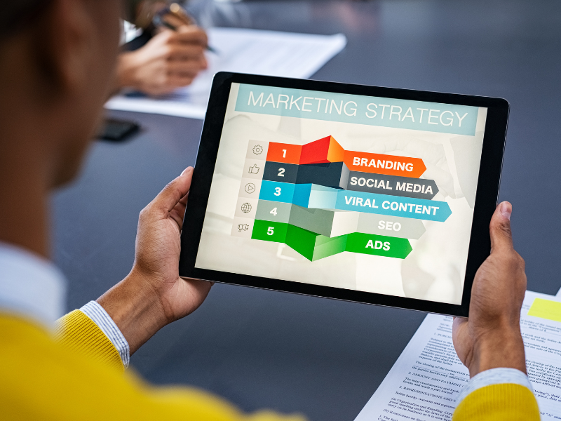 person analyzing strategies on how to market a manufacturing company
