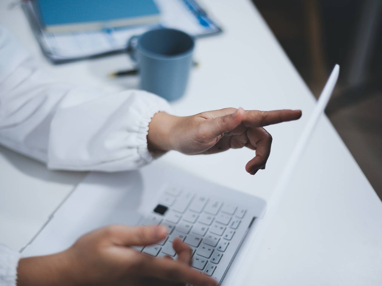 Businesswoman exploring SEO for their website in 2026 strategy on her work laptop.
