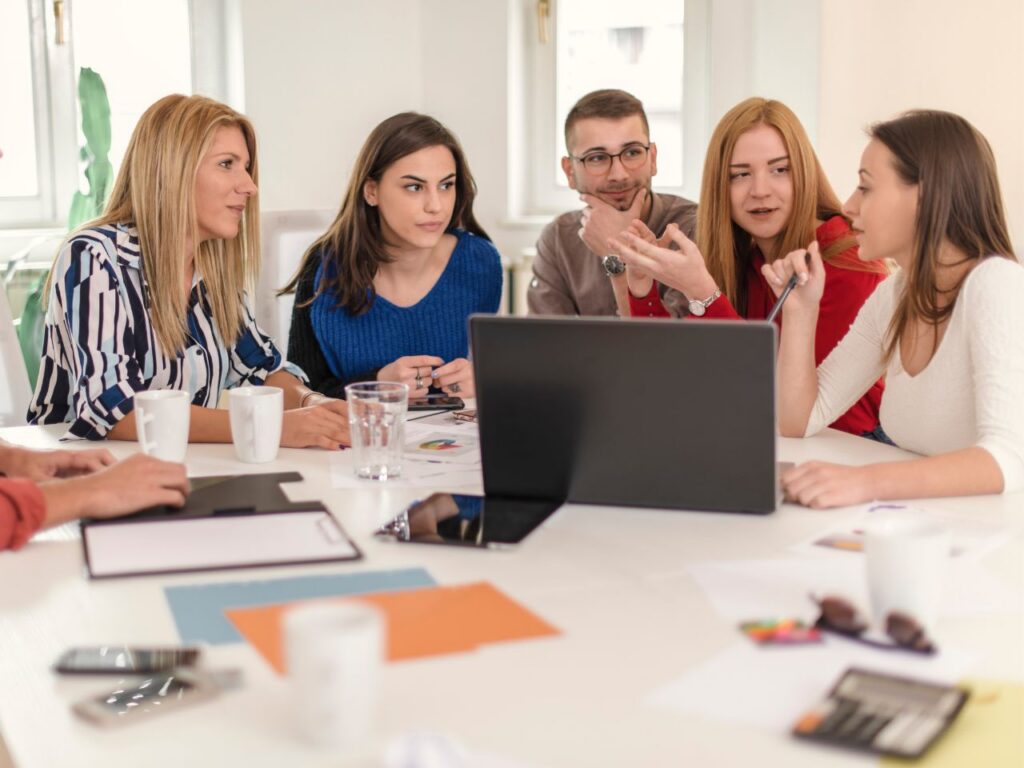B2B marketing team discussing strategies based on how long SEO takes to show results.