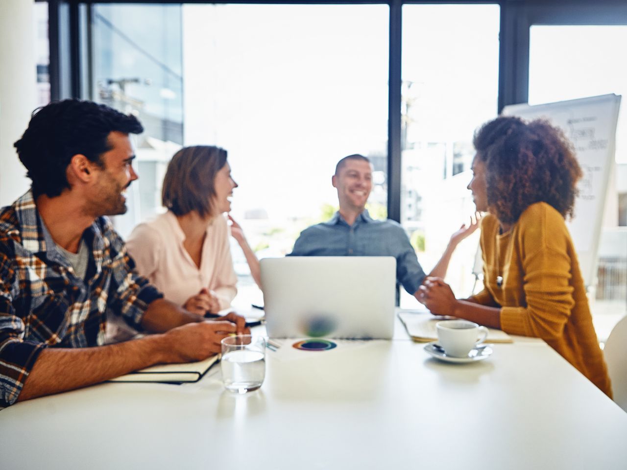 Marketing professionals discussing how to get cited in Google AI Overviews 2026 using AI search, SEO, and content strategies to improve B2B visibility and citations.